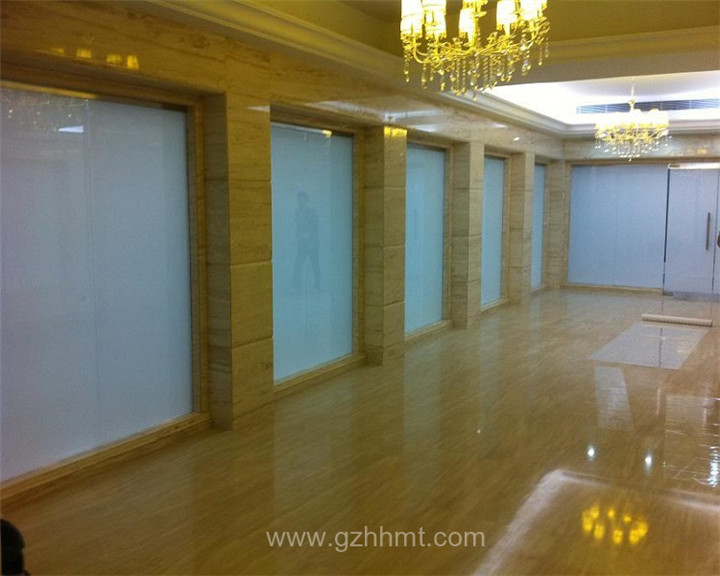 smart glass partition in a indoor swimming pool